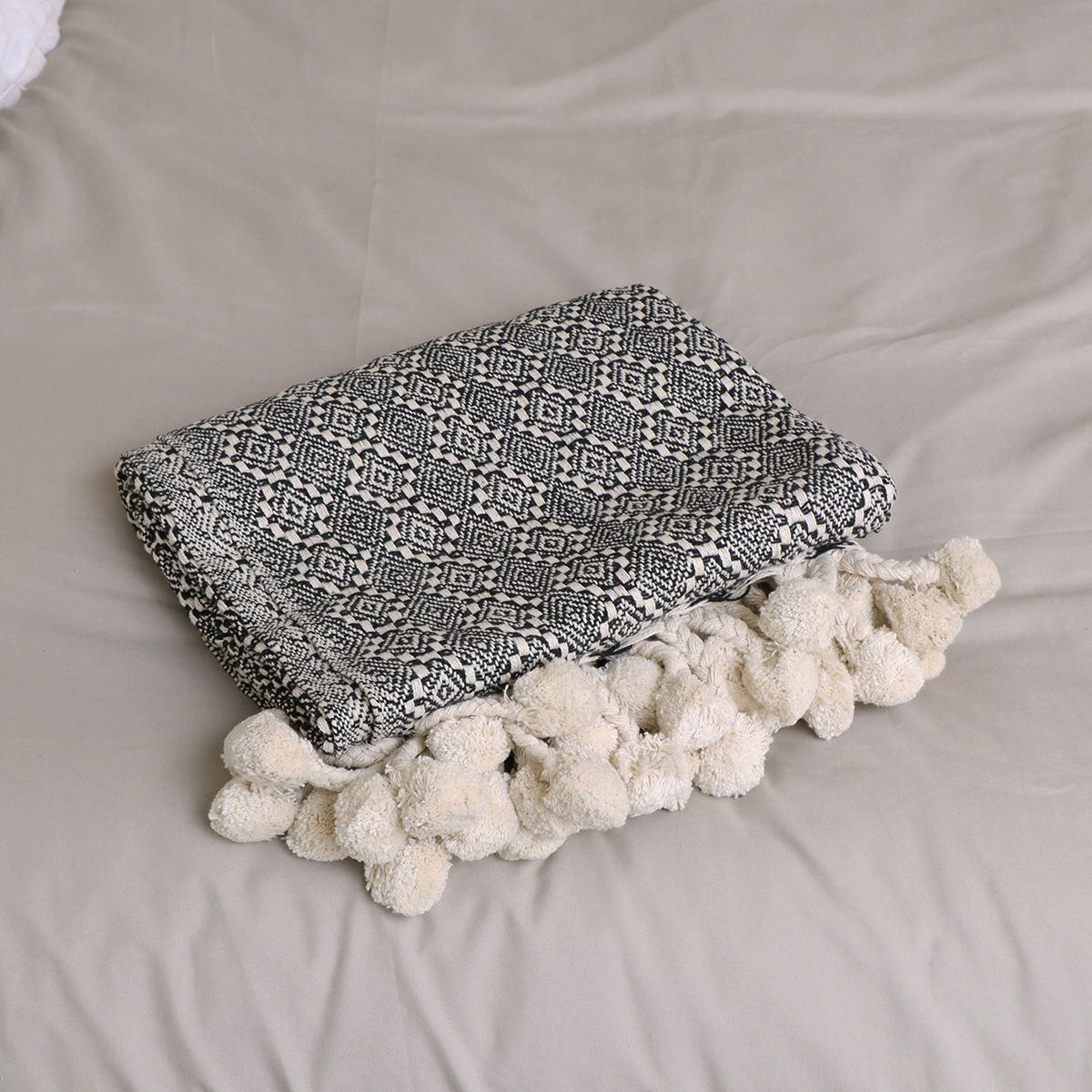 Black and White Pattern Throw with Pom Poms - 130cm x 160cm