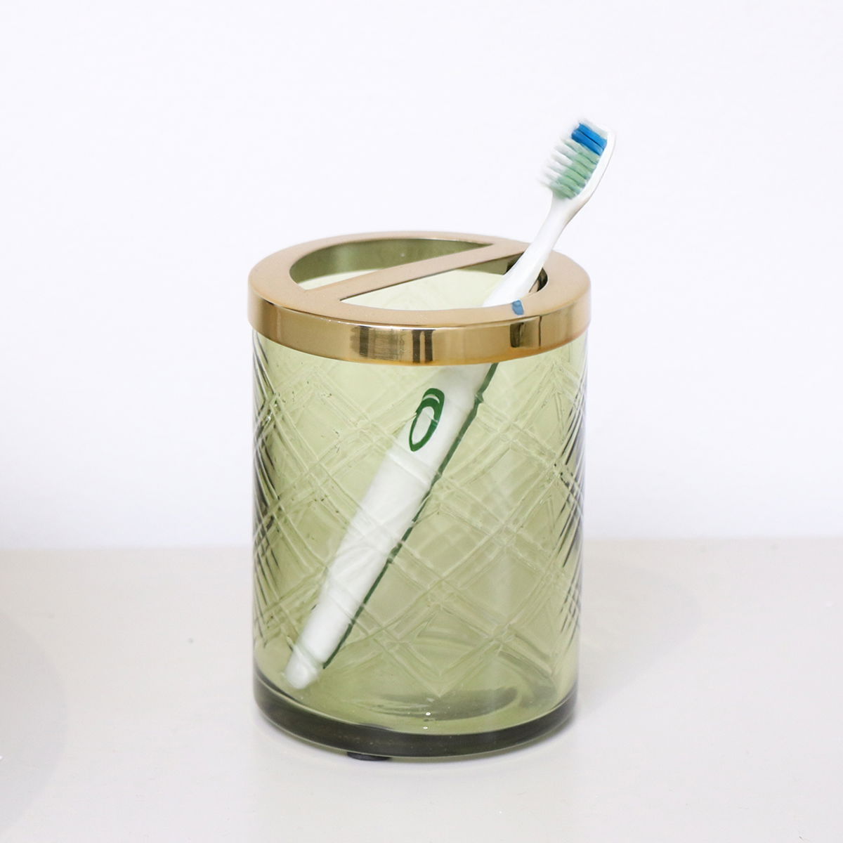 Green Patterned Glass Toothbrush Holder with Gold Rim